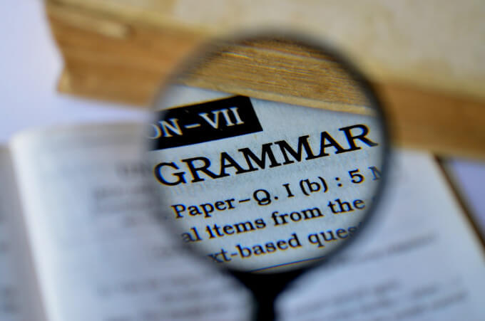 The word 'Grammar' on a magnifying glass